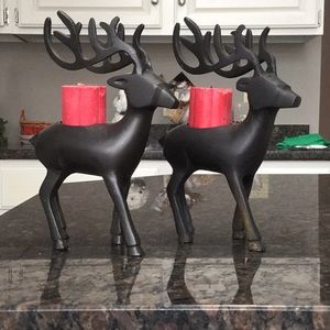2 metal reindeer candle holders with candles